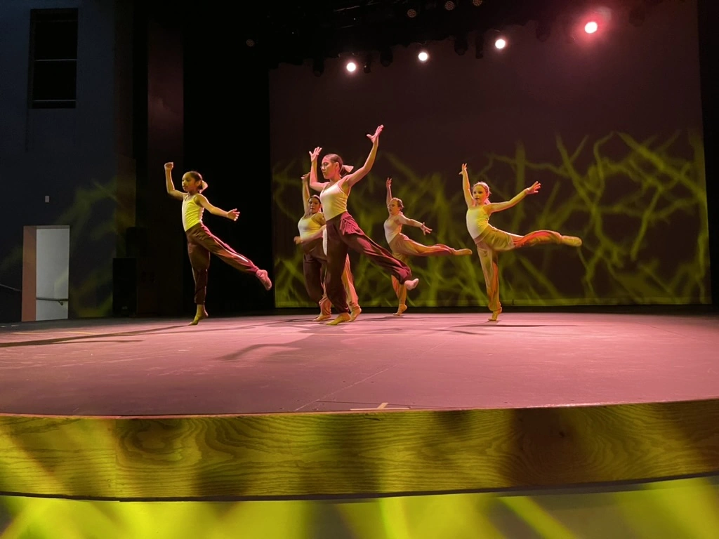 Company dancers in pastel ballet skirts performing on stage