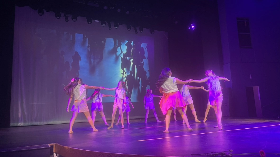 The Movement Dance Company performing a contemporary piece on stage