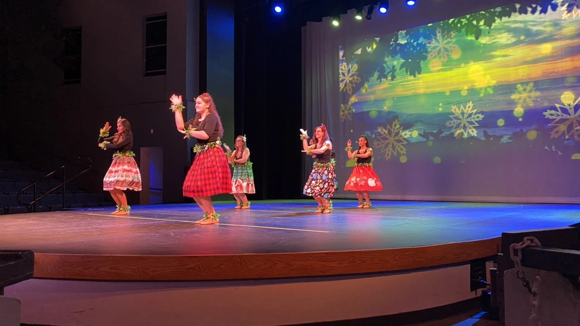 Encore adult dancers performing together under stage lights