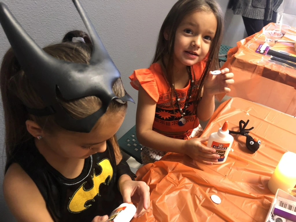 Little superheroes making Halloween crafts