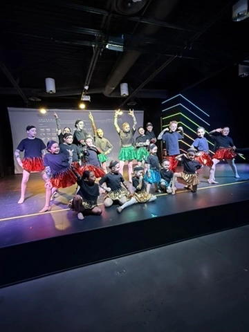 Kids celebrating a birthday party on the Ovation Theatre stage